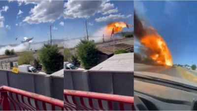 飞机洒水灭林火　意外撞电杆爆炸起火坠毁高速公路